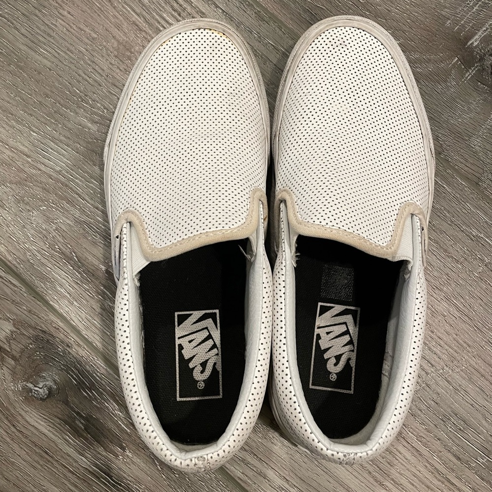 Vans perforated white slip ons